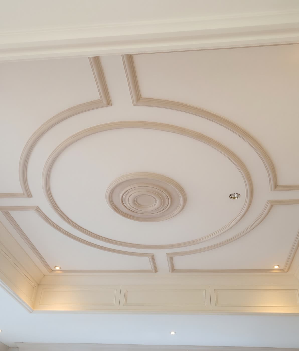 Plaster ceiling panels framing a ceiling rose