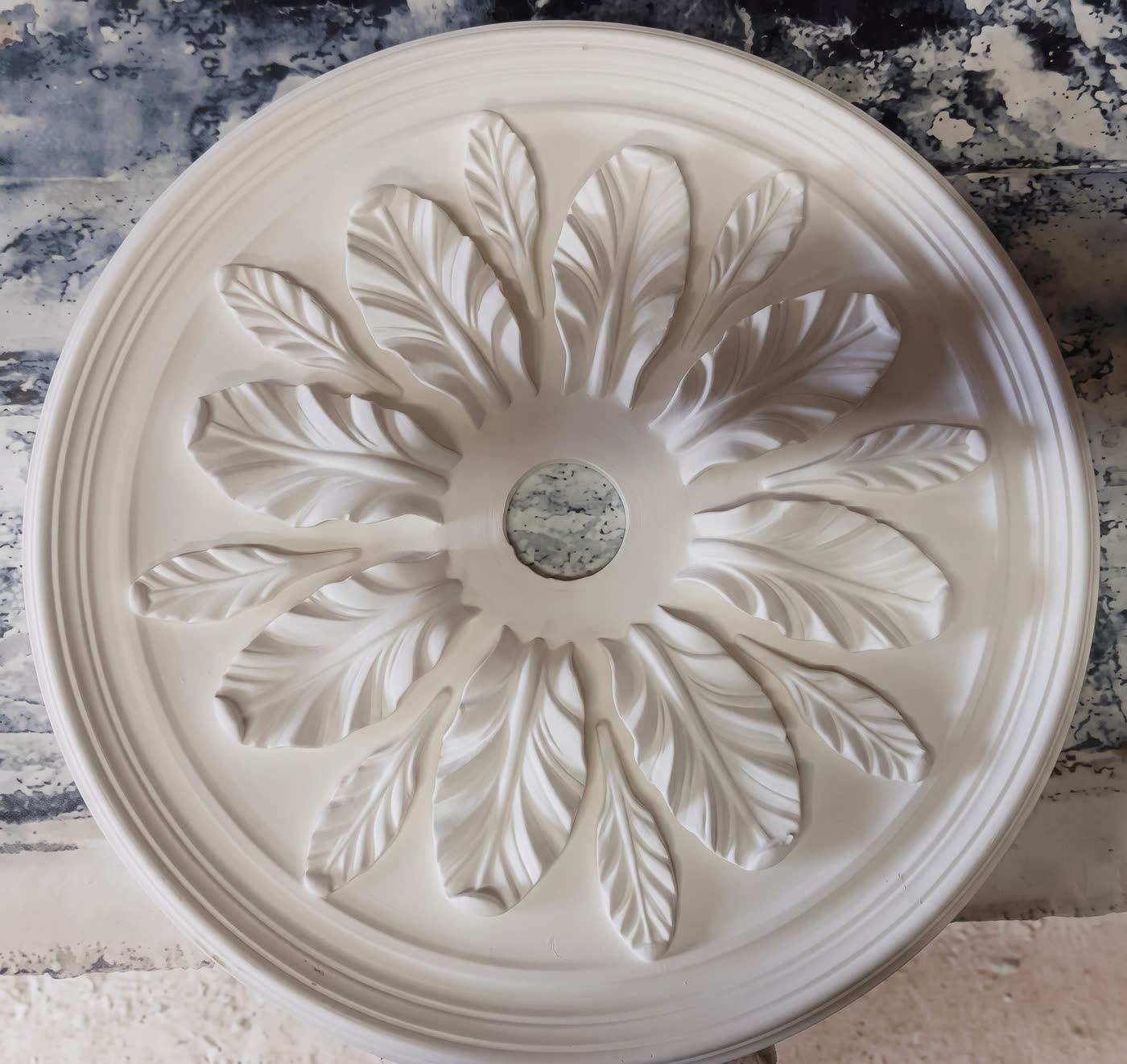 Ornate plaster ceiling rose with a leaf design
