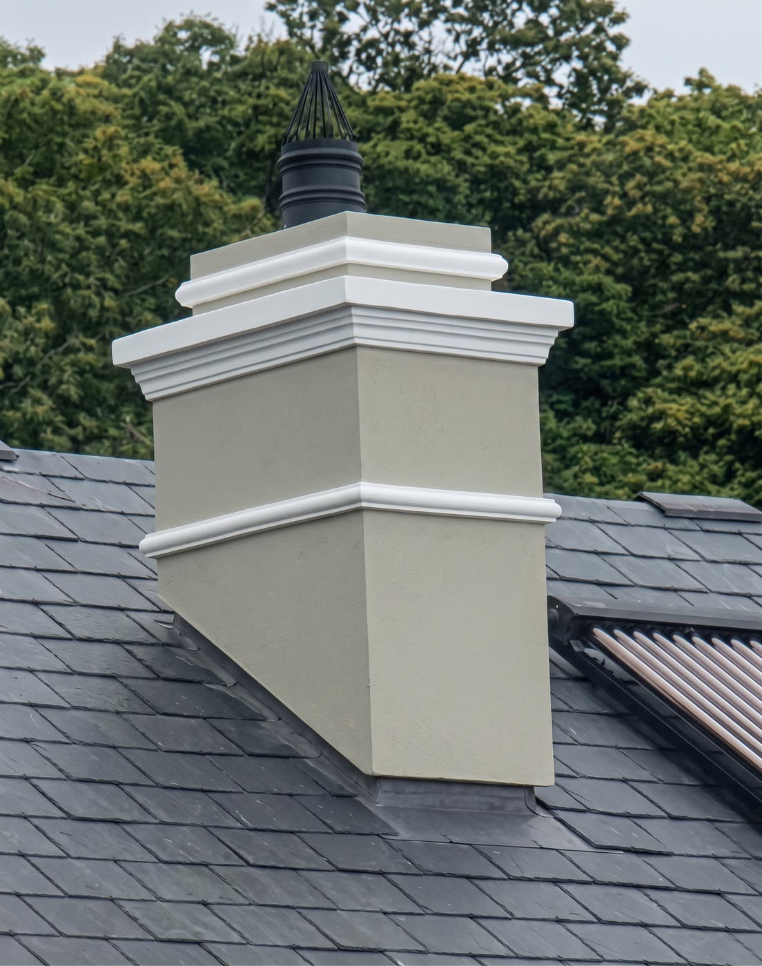 False chimney with a plaster capping on a slate roof