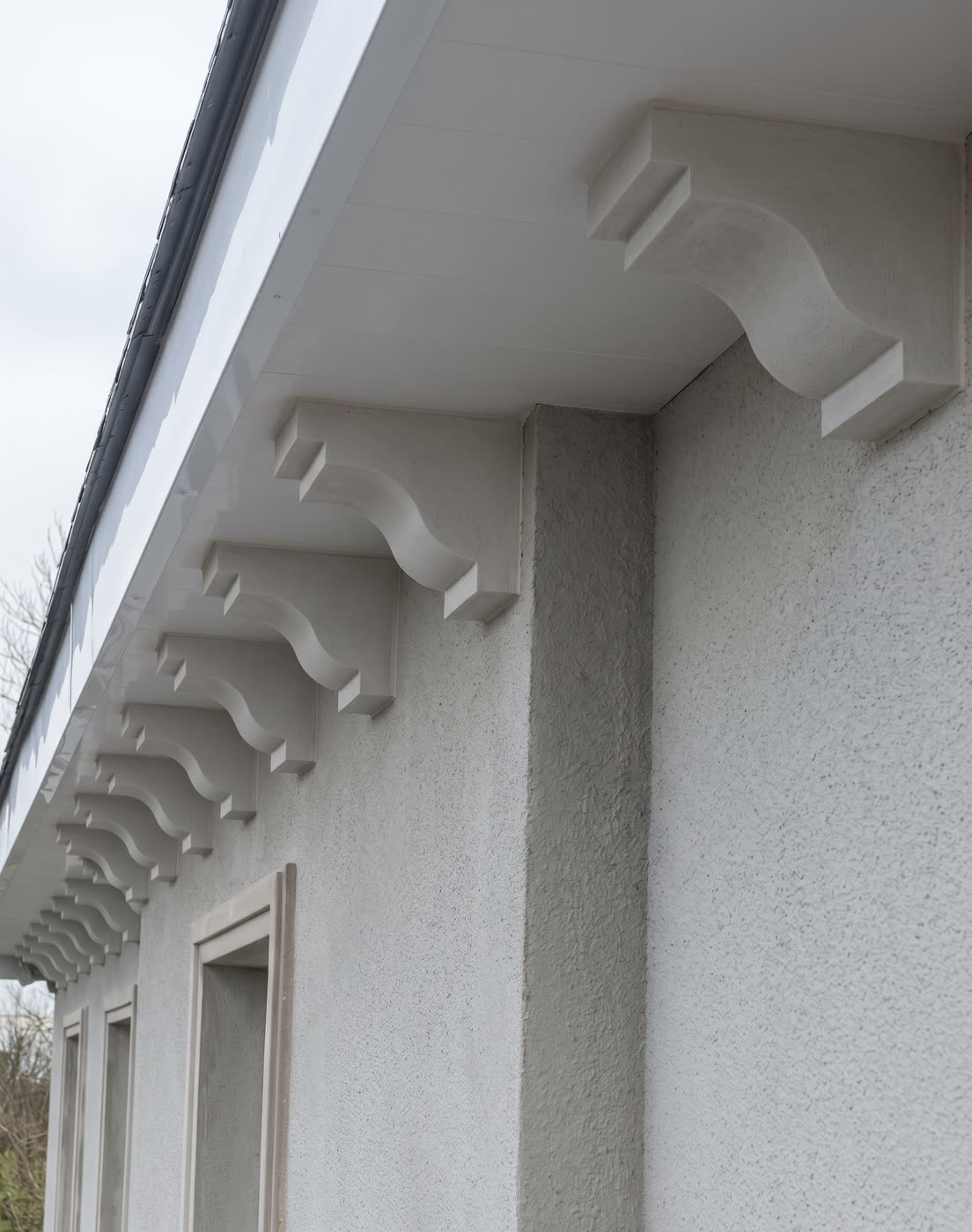 Plaster soffit blocks supporting the eaves of a house